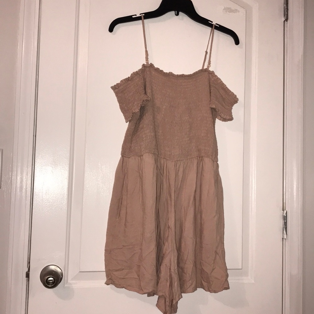 A pink/creamy romper  with off shoulders